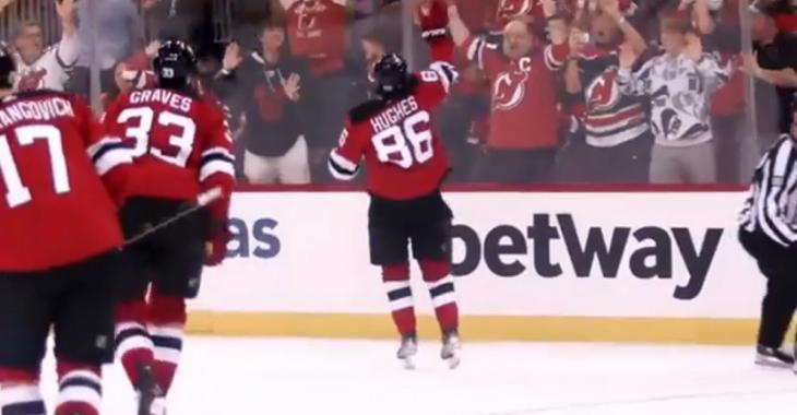 Jack Hughes throws his stick into the crowd after incredible OT winner.